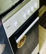 Gas stove same as new with gas. Available also small refrigerator and sofa good for 2 person